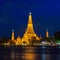 Twilight time of Wat Arun across Chao Phraya River in Bangkok, T