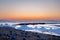 Twilight Tranquility: Afterglow on Crete\\\'s Beach with Concrete Breakwater