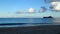 Twilight Tranquility: Rabbit Island Silhouette at Waimanalo Beach