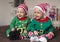 Twin babies elf helper of Santa