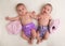 Twin babies girls with ecologic cloth diapers