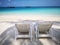Twin beach chairs on fine white sand
