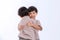 Twin boys hugging  on white background. Portrait of little son hugging brother or friend. I missing you. Full length happy boy emb