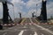 Twin bridge is opening with closed barriers at the sluice named Julianasluis in the Gouwe canal at Gouda, the Netherlands