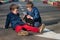 Twin brothers play with a toy car