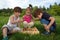 Twin Brothers Playing Chess In The Park While Cute Little Girl Watching The Game