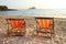 Twin deck chairs on the beach