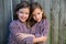 Twin girls dressed up as siamese with his father shirt