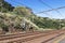 Twin Rail Tracks Leading Through Rural Railway Station