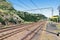 Twin Rail Tracks Leading Through Rural Railway Station