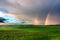 Twin rainbow with overcast sky a