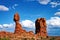 Twin rock columns in Utah, with one supporting a large balanced boulder