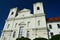 Twin towers of baroque Jesuit Church Of Saint Francis Xavier in Skalica from year 1693, sunlit by afternoon summer sunshine