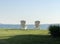 Twin white Adirondack chairs seaside in sunlight