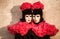 Twins couple with black and red costume during venice carnival