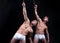 Twins men doing sport exercises, yoga studio shot on black background. Strong man showing his perfect body on black