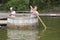 Twins playing in a barrel 04