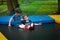 Twins are resting on the trampoline