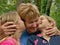 Twins, sister kiss a grandmother