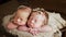 Twins sisters newborn in the winding