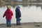 Twins stand near the lake