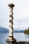 Twisted column in the background of mountains near Lake Como. Villa Monastero, Italy