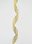 Twisted golden silk decorative ribbon for packing gifts on a white background