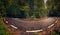 Twisted road through a beautiful forest in the mountains during autumn