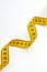Twisted yellow measuring tape.