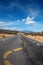 Twisting lane marking on road in desert