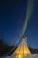 Twisting Northern Lights Arc over Teepee