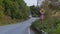 Twisty asphalt road with speed sign