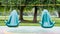 Two abandoned swings at a children`s outdoor playground