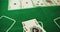 Two Aces Thrown on Green Casino Table. Playing poker. Top view. Slow Motion