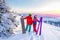 Two active friends snowboarder and skier standing on mountain top blue sky sunrise. Concept ski resort winter forest