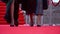 Two actresses are walking on the red carpet, close up