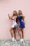 Two adorable blondes in little dresses making selfie and having fun.