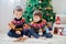 Two adorable children, boy brothers, eating cookies and drinking