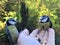 Two adorable little eurasian Blue Tits eating off man`s hand