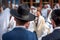 Two adult Hasidim in traditional Jewish headdresses hat and kippah. Prayer of Hasidim