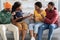 Two african american couples having fight, home interior