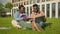 Two African American friends students high school in park studying together classmates university college outdoors