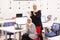 Two african american muslim girls with hijab applauding. Colleagues cheering together in a modern office