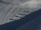 Two alpinists walking on snow