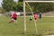 Two amateur football teams play on the field in