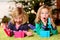 Two amazed girls with christmas presents