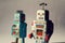 Two angry vintage tin toy robots, artificial intelligence, robotic drone delivery, machine learning concept