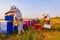 Two apiarists, beekeepers are harvesting honey, vintage