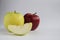 Two apples yellow green and an Apple slice a piece of Apple