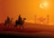 Two Arab men riding camels in the desert